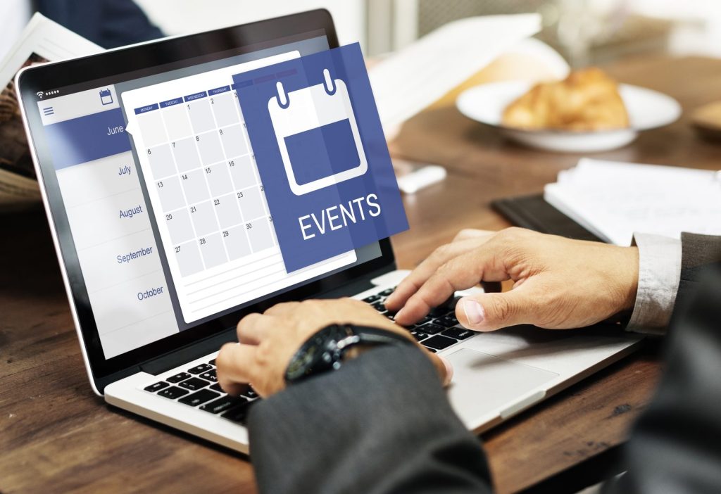 HR manager and event planner reviewing corporate event planning