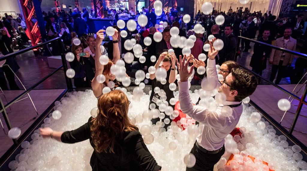 Guests immersed in a live experiential event moment