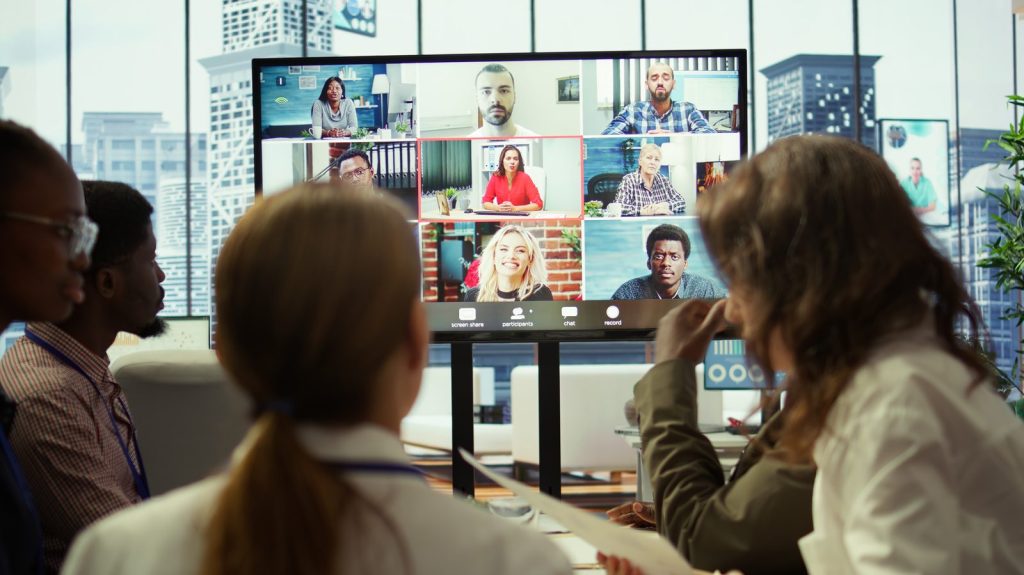 Hybrid corporate event trends 2026 with live streaming and stage setup