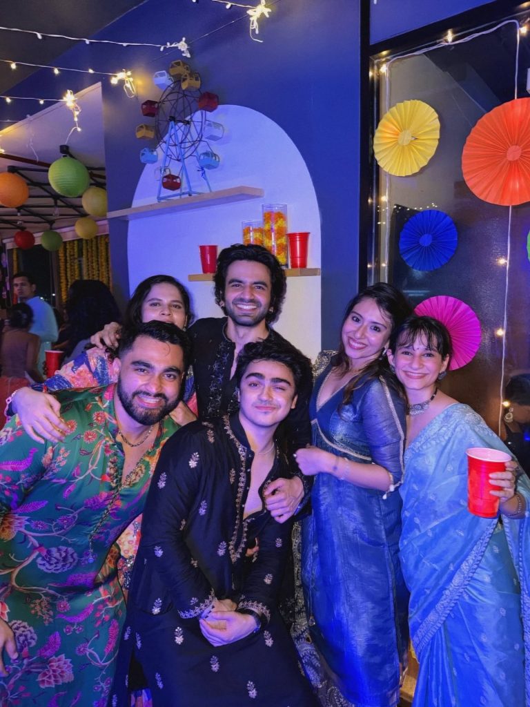 Friends posing for a picture at a Diwali party