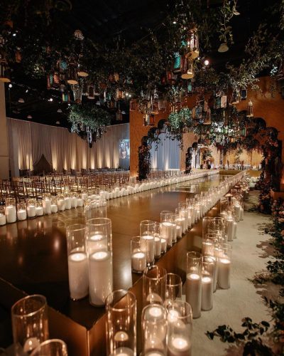 Entry Surrounded by Candlelit Aisles