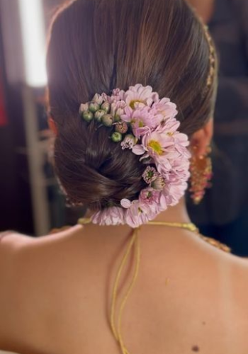 Textured low bun with gajra – elegant party hair style for girls